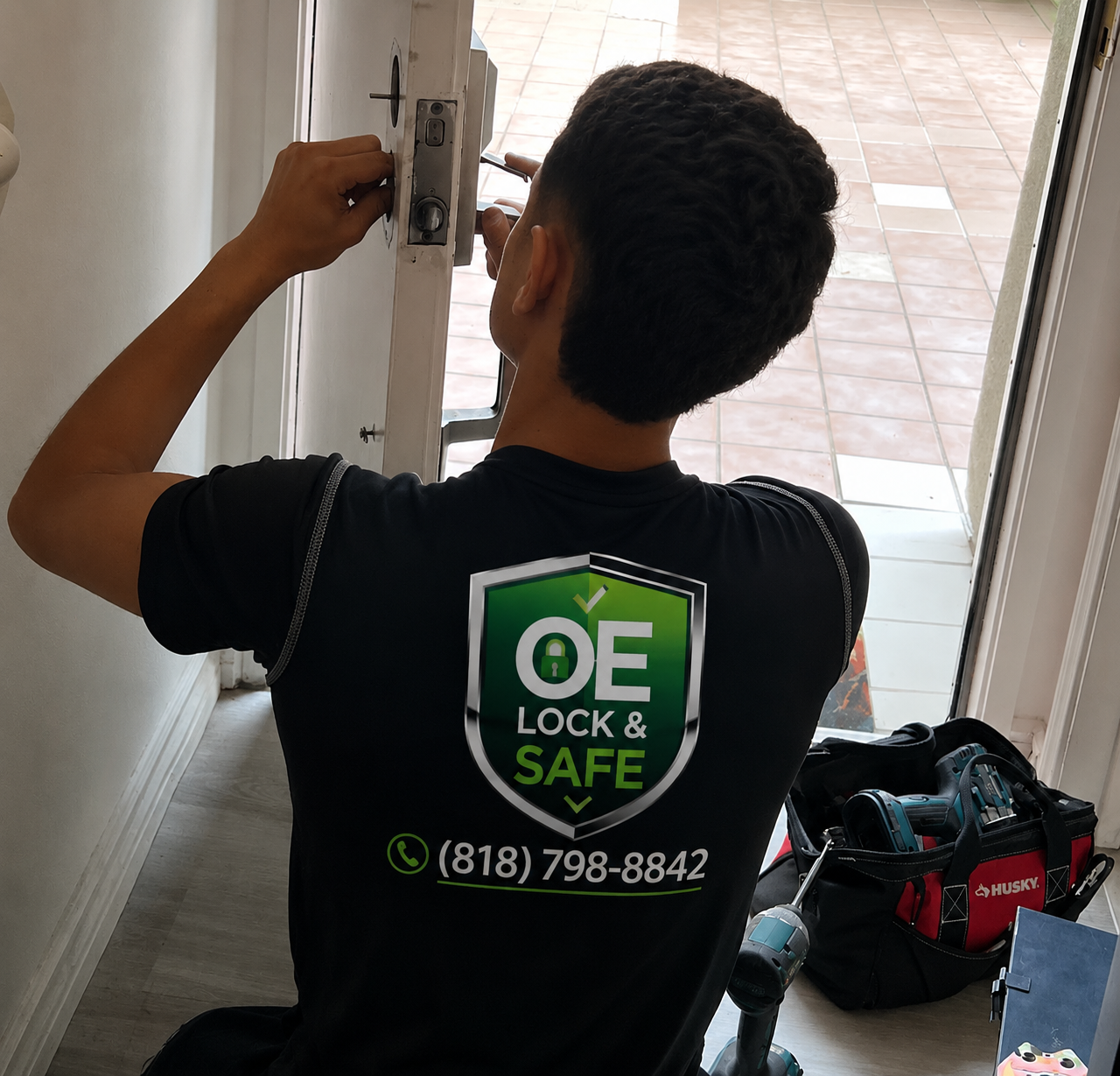 Technician opening a residential door from inside during a house lockout service