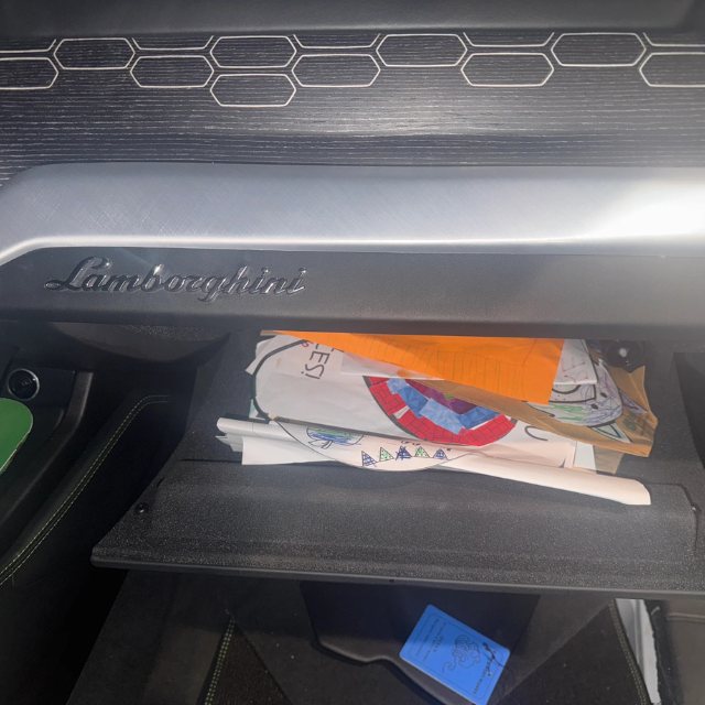Opened locked Lamborghini Urus glove box